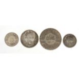 Four Persian silver coins, the largest 4cm in diameter : For Further Condition Reports Please