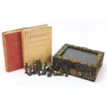Eleven African bronzed Ashanti gold weights and two reference books, The History of the Gold Coast