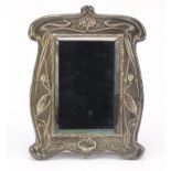 William Neale & Sons, Art Nouveau silver easel mirror with bevelled glass, embossed with stylised