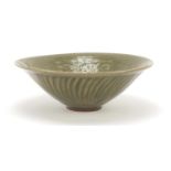 Korean porcelain bowl having a celadon glaze, decorated in low relief with birds and flowers, 19cm