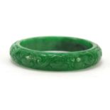Chinese green jade bangle carved with dragons, 8cm in diameter : For Further Condition Reports
