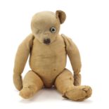 Antique golden straw filled teddy bear with articulated limbs, 58cm high : For Further Condition