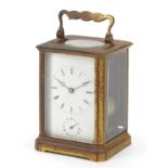 French brass carriage clock with subsidiary and enamelled dial having Roman numerals, 11cm high :