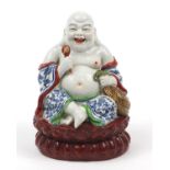 Chinese porcelain figure of seated Buddha, impressed character marks to the base, 21cm high : For