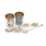 Two silver plate and enamel spirit measures and three white metal collector's spoons, the largest