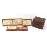 Chinese mahjong set housed in a camphor wood five drawer chest carved with figures, 15.5cm H x 20.