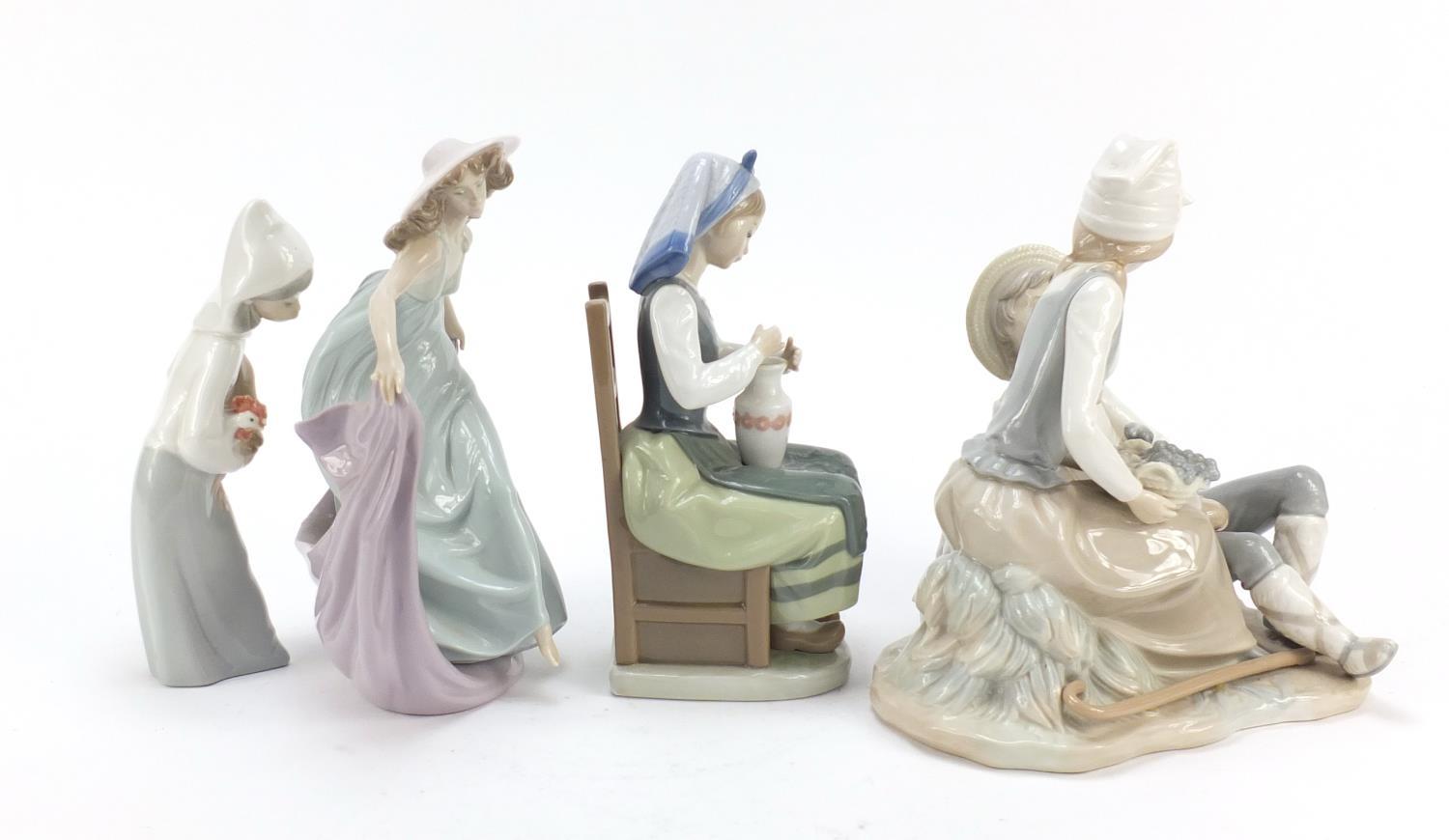 Four Lladro and Nao figure groups, the largest 23cm high : For Further Condition Reports Please - Image 6 of 10