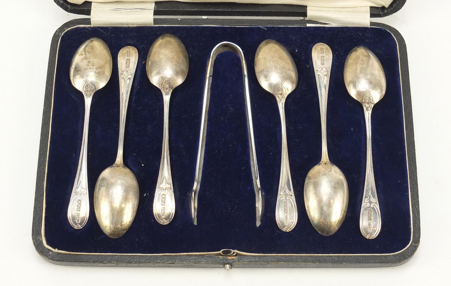 James Dixon & Sons, Set of six George V silver teaspoons and sugar tongs housed in a Harrods case, - Image 3 of 6