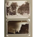 Eastbourne and Hailsham black and white postcards arranged in an album, some photographic, including