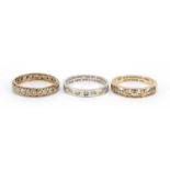 Three 9ct gold rings including two with inscriptions and an eternity ring, sizes N and O : For