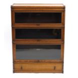 Oak Globe Wernicke three section bookcase with drawer to the base, 115.5cm H x 87cm W x 30.5cm D :