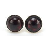 Pair of 9ct gold garnet stud earrings, 7mm in diameter, 1.7g : For Further Condition Reports