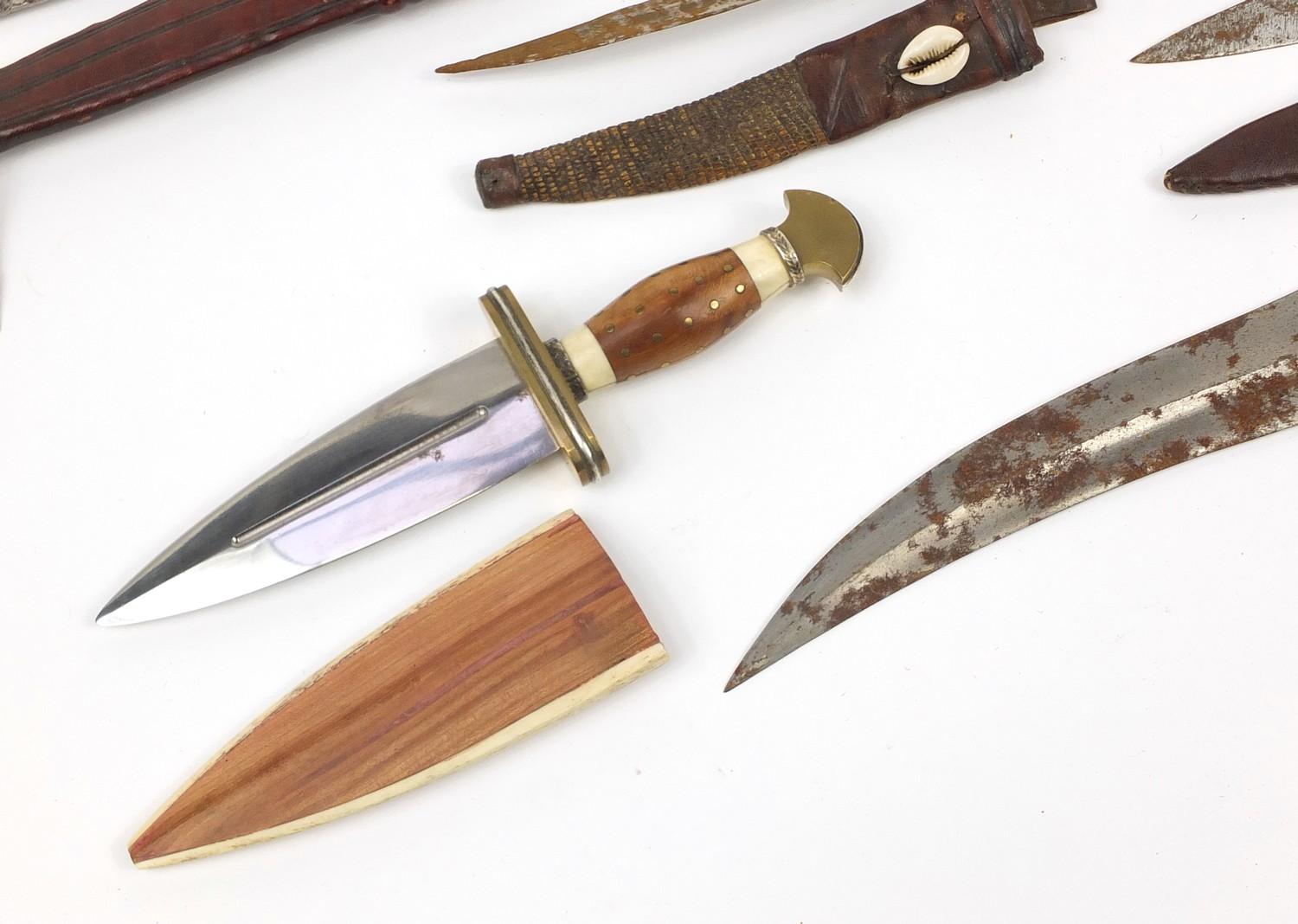 Seven daggers including a taxidermy interest example with lizard head handle, the largest 35cm in - Image 3 of 9
