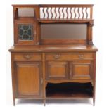 Arts & Crafts oak side unit by Maple & Co with mirrored back and stained glass leaded door above