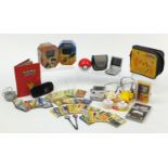 Pokemon collectables including trade cards, a Play Station PSP console and two Game Boy consoles :