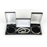 Three silver necklaces housed in gift boxes, 68.6g