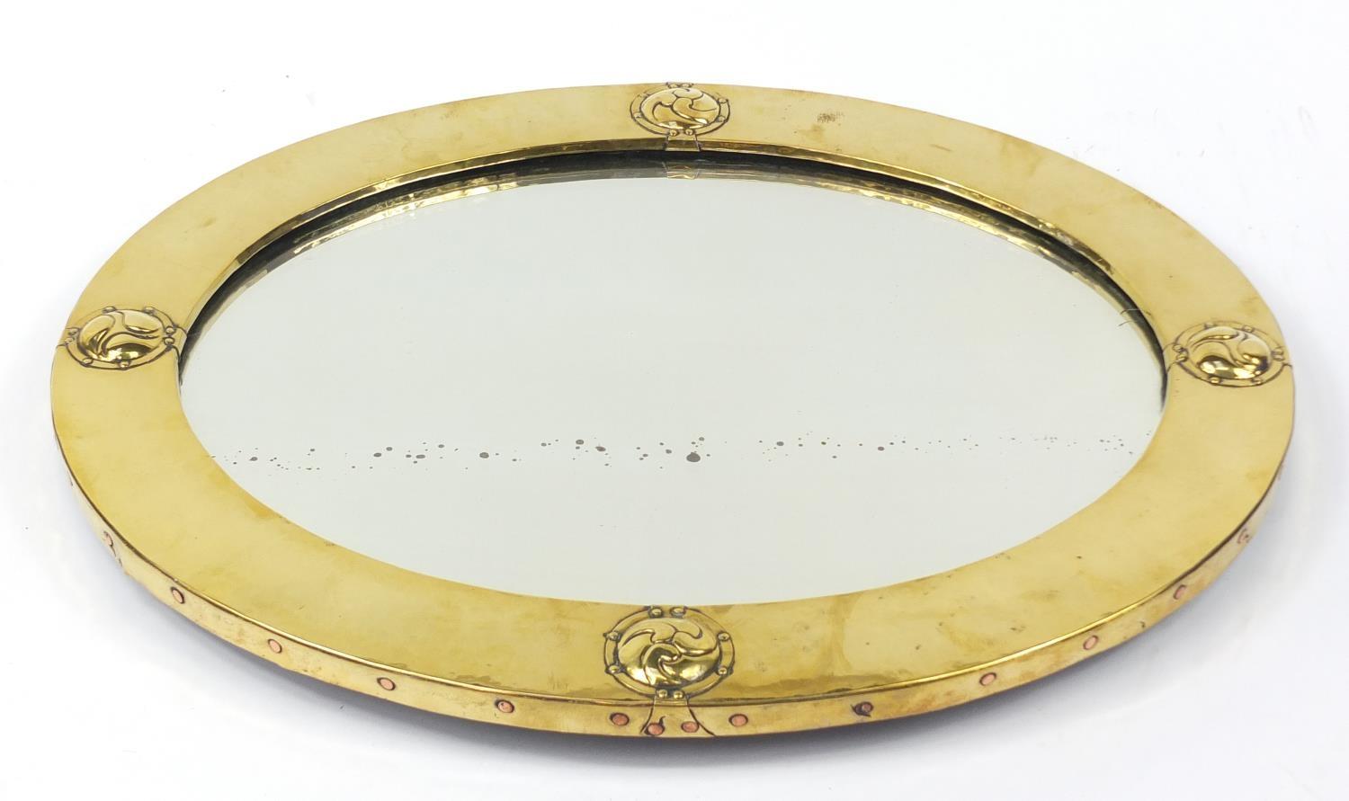 Liberty & Co, Arts & Crafts planished brass and copper mirror with embossed roundels, Liberty London - Image 5 of 5