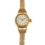 Longines, ladies 18ct gold manual wristwatch with 9ct gold strap, 15mm in diameter, 15.8g