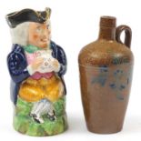 Staffordshire Toby jug and a stoneware flagon hand painted with stylised fonts, 22.5cm high