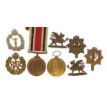 British military World War I medals and cap badges including a Victory medal awarded to 576652PTE.