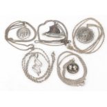 Five silver pendants on silver necklaces, 36.0g
