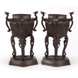 Pair of Japanese patinated bronze incense burner design vases with dragon handles, each carved