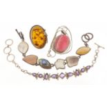 Silver jewellery comprising two semi precious stone bracelets, a large amber ring and polished stone