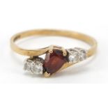 9ct gold red and clear stone crossover ring, size N, 1.7g