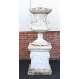 Very large cast iron Campana shaped urn and cover on stand with twin handles raised on square