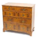 Antique walnut feather and cross banded five drawer chest fitted with two short above three long