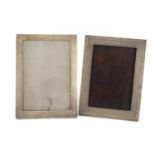 Two rectangular silver easel photo frames, one with engine turned decoration, hallmarked