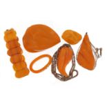 Butterscotch amber coloured jewellery comprising bracelet, pendant, two brooches and a ring, the