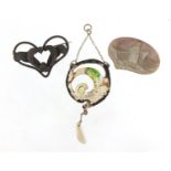 Art Nouveau enamelled pendant, unmarked brooch and a carved mother of pearl brooch, the pendant