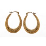 Pair of 9ct gold hoop earrings with chased decoration, 2.5cm high, 0.8g
