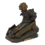 Cold painted bronzed figure of a boy in a cart with plaque engraved Du 40 à l'heure, 11.5cm high