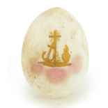 Russian egg in the style of Fabergé gilded with a cross, 6.3cm high