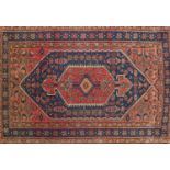Rectangular North West Persian rug having an all over stylised floral design, 193cm x 133cm