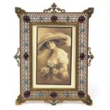 Ornate pierced brass easel photo frame set with turquoise and red cabochons, 21.5cm high x 16cm wide