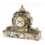 French Art Deco marble and green onyx striking mantle clock with enamelled dial, the movement