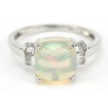 9ct white gold cabochon cushion opal ring set with diamonds to the shoulders, size O, 2.6g