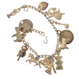 Silver charm bracelet with a selection of mostly silver charms including ballerina, trumpet, horse