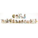 Eighteen Beswick Beatrix Potter figures including Miss Moppet, Mrs Tiggy Winkle and Sally Henny