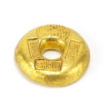 Chinese gold coloured metal ingot, 4cm in diameter