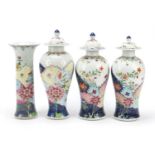 Chinese porcelain four piece garniture comprising three baluster vases with covers and a cylindrical