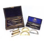 Two 19th century drawing sets including a rosewood example with brass instruments and an ivory