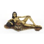 Cold painted bronze figure of a reclining nude female on a tiger rug, in the style of Franz Xaver
