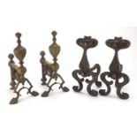 Pair of Art Nouveau cast iron fire dogs with inset copper spade design plaques together with a