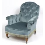 Blue button back upholstered chair on octagonal walnut tapering legs, 88cm high