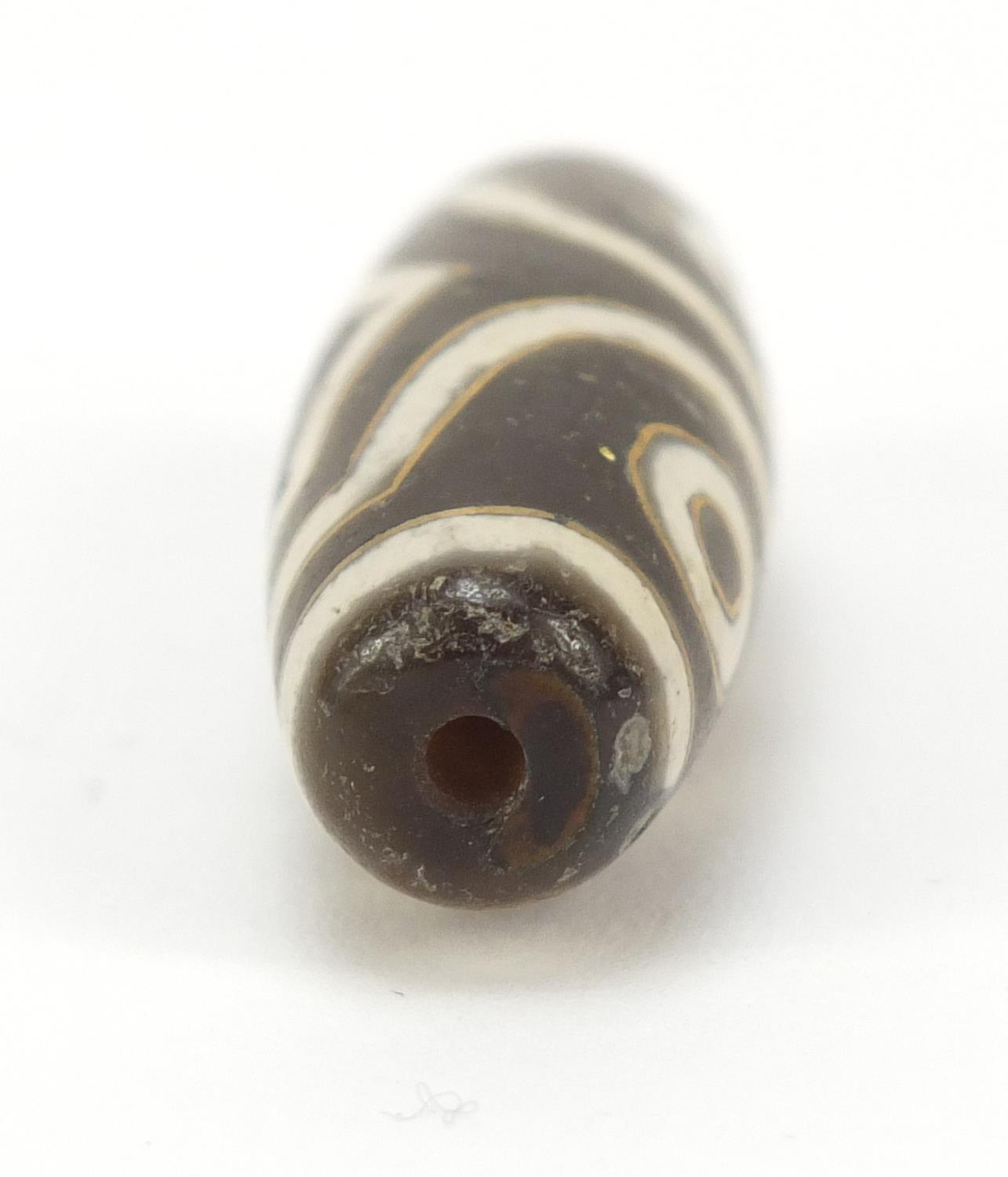 Tibetan dzi bead, 2.5cm wide - Image 2 of 7