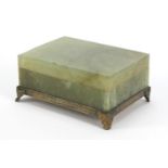 Chinese green jade box and cover carved with flowers on bronzed base, 6cm H x 13cm W x 10cm D